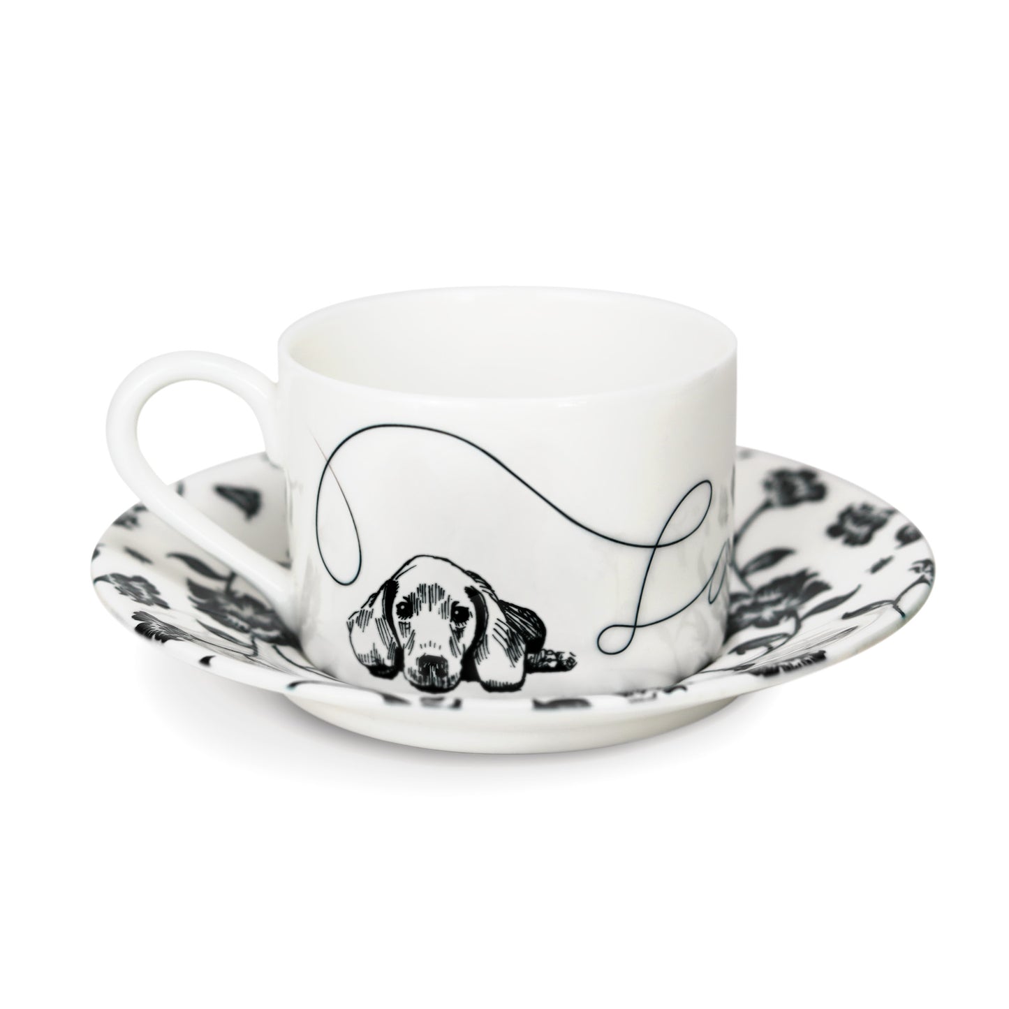 Cup and saucer featuring a hand-illustrated dog design.