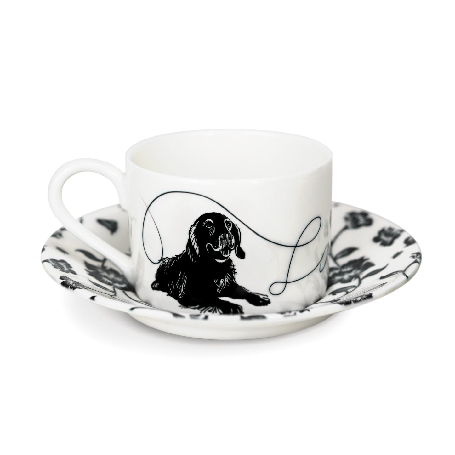 Cup and saucer featuring a hand-illustrated dog design.