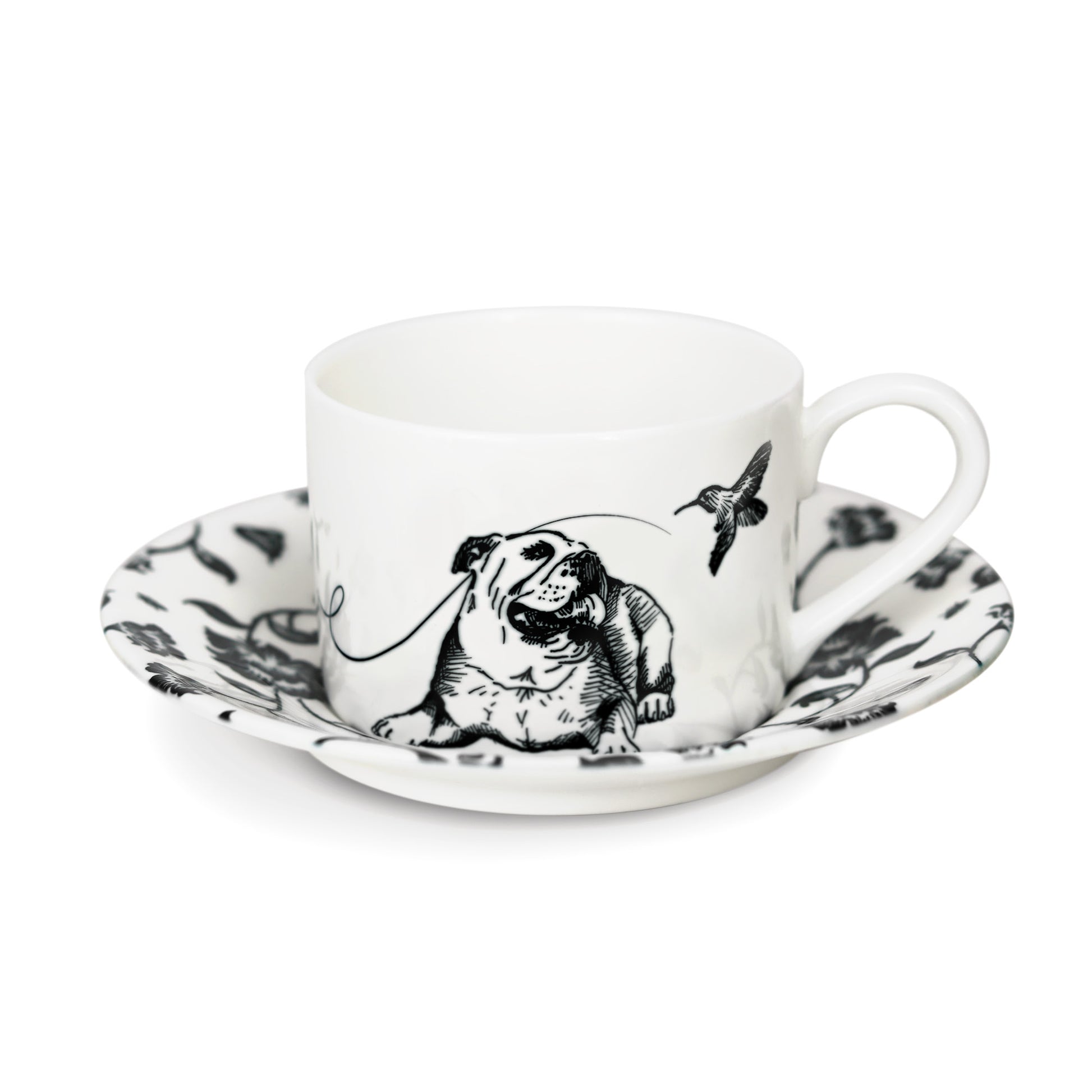 A black and white cup and saucer featuring a bulldog design, elegantly displayed against a neutral background.